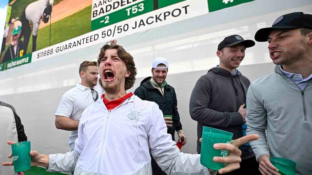 Fans celebrate off the 16th green during the continuation of the second round of the WM Phoenix Open at TPC Scottsdale on Saturday, Feb. 10, 2024.